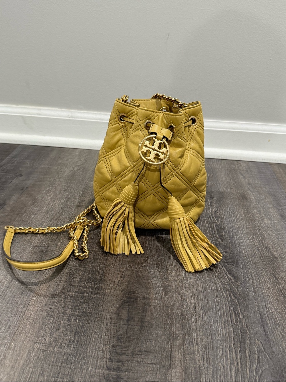 Tory Burch Mustard Quilted Leather Tassel Bucket Crossbody